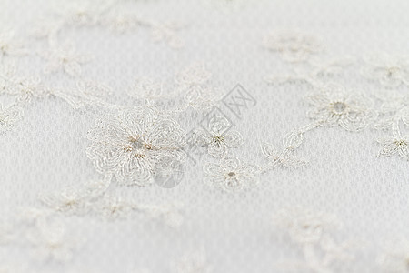 美丽的蕾带棉布装饰白色材料衣服装饰品织物风格黄色婚礼图片