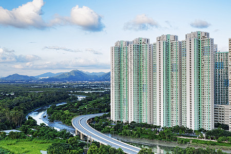 香港的公有财产家庭住房民众住宅景观高楼贫民窟生活日落窗户图片