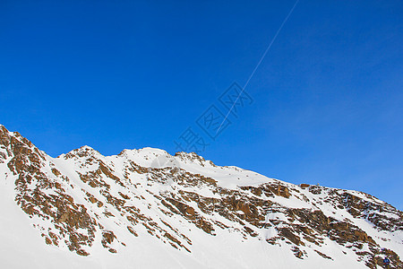 冬季山区岩石顶峰首脑高山冰川晴天单板全景天空蓝色图片