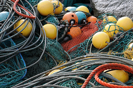 美丽颜色的鱼网蓝色港口工作渔船海洋绳索材料海滩橙子钓鱼图片