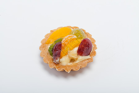 甜甜的蛋糕 有水果 以白叶子隔绝餐厅浆果馅饼橙子甜点饮食奇异果小吃奶油糕点图片