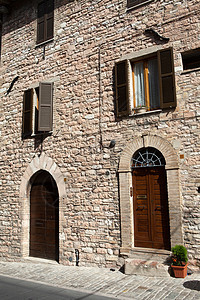 意大利山镇阿西西的中世纪街遗产历史爬坡旅游石头车道旅行街道地标文化图片