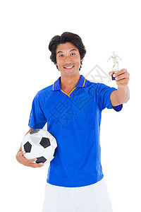蓝握足球运动员奖得奖奖杯微笑优胜者幸福男性快乐活动播放器杯子欣快感世界图片