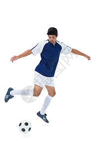 蓝踢球的足球运动员杯子蓝色齿轮运动服运动播放器团队活动男人闲暇图片