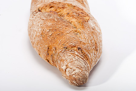 传统烤熟面包的大型小面包小麦食物静物纤维燕麦乡村麻布谷物宏观面粉图片