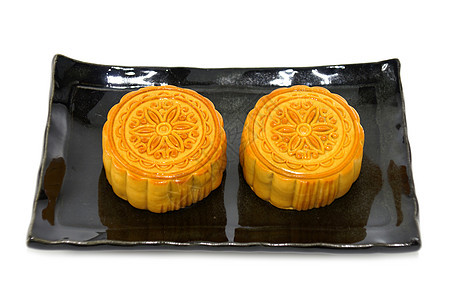 白色背景的中国月饼 花朵在Th上小吃糕点食物美食黄色文化月亮蛋糕季节性庆典图片