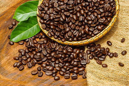木制背景的咖啡豆休闲时间茶几烘烤咖啡厂咖啡公司火锅咖啡馆早餐酿造图片