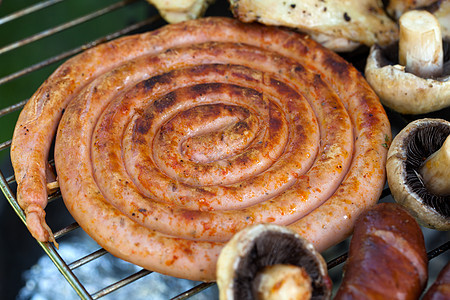 在烤架上用美味的烤肉烧烤小鸡食物食谱牛肉香肠花园猪肉烹饪派对羊肉图片