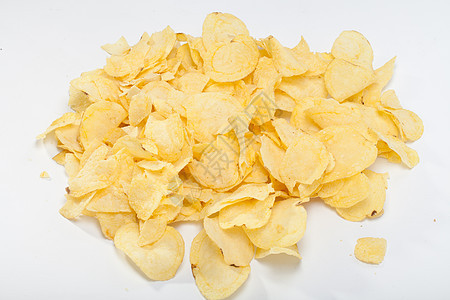 白背景孤立的土豆薯片盐渍油炸黄色色彩食物小吃宏观波纹饮食饼干图片