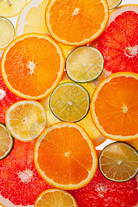 特写的柑橘水果中不同彩色切片的背景果汁团体食物营养柠檬异国柚子橙子热带维生素图片