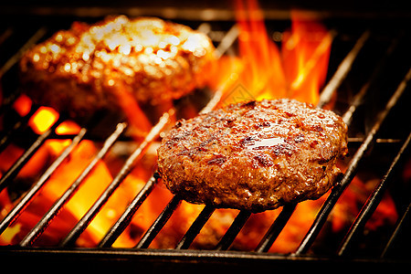 恶性汉堡汉堡晚餐黑色炙烤棕色牛肉食物黄色白色午餐红色图片