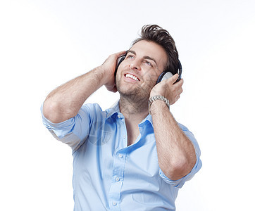 带耳机的男子男性娱乐音乐微笑闲暇蓝色工作室男人衬衫乐趣图片