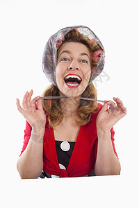 妇女有卷发机造型红色发型滚筒女性头发女士美丽发型设计围巾图片