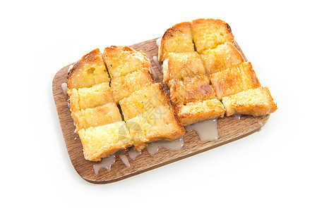 面包面包和木板上的冷凝牛奶食物盘子黄油午餐牛奶早餐烘烤木头白色甜点图片