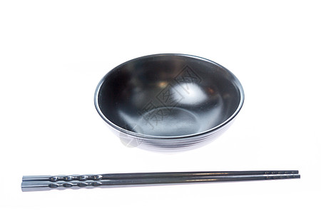 碗桌上的黑筷子木头盘子文化陶器美食黑色餐厅白色用具图片