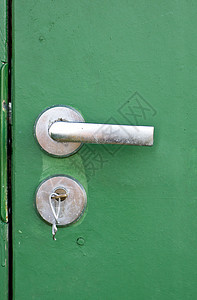 锁着旧门绿色入口金属钥匙锁孔图片
