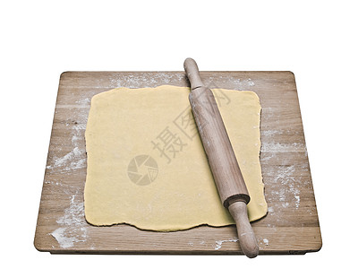 烘烤板上的松饼面团馅饼水平脆皮食物片状黄油脑袋烘烤滚动木板图片