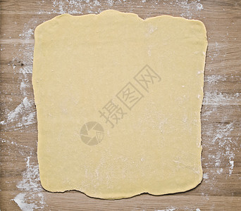 烘烤板上的松饼面团黄油木板脑袋水平馅饼片状食物脆皮烘烤图片