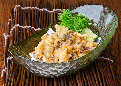 日食 炒鱿鱼在背景上海鲜章鱼美食午餐食物饮食盘子红色白色寿司图片