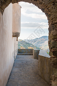古石之窗蓝色边界胡同骑士鹅卵石自然建筑学古董框架岩石图片