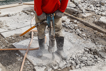 使用地面钻井水泥的工人建造工地工具钻孔工业地面机械工作钻头机器力量水泥图片