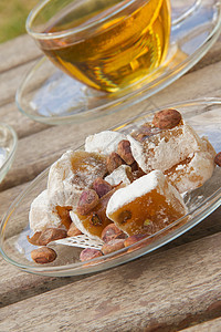 土耳其人喜欢盘子上有活塞地种子软糖咖啡休闲木质芝麻表面舒适肥胖时光时间图片