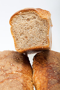 传统烤熟面包的大型小面包产品亚麻玉米小麦谷物面团宏观美食燕麦消费者图片