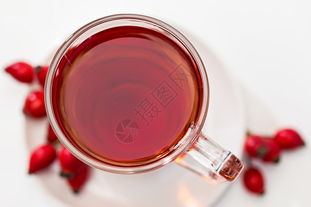 白色背景上孤立的玫瑰花茶杯子茶杯茶点橙子饮料植物玫瑰杯子果味药品保健图片