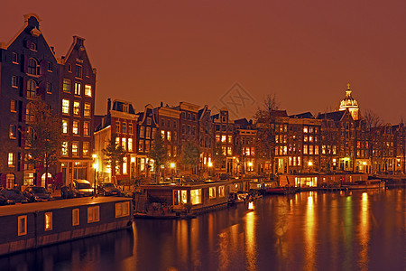 夜间从荷兰阿姆斯特丹到荷兰的城市风景建筑房子历史特丹船屋城市运输风光首都建筑学图片