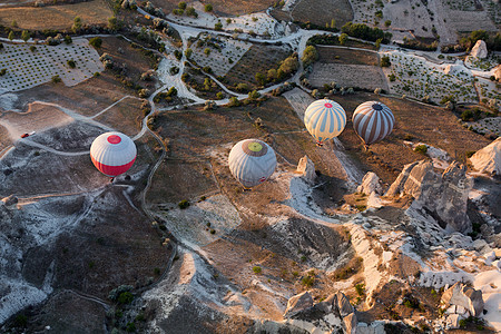 土耳其卡帕多西亚 卡帕多西亚最大的旅游景点 日出时气球飞行缆车烟囱月球洞穴闲暇地标篮子空气火山丘陵图片