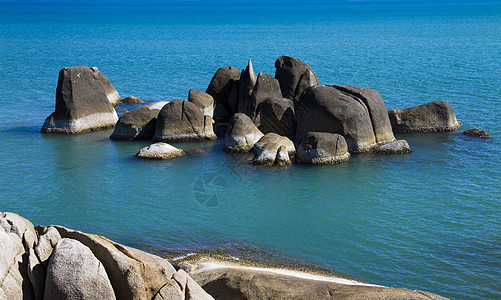 海洋和石头假期热带海景日出岩石天堂场景旅游旅行海滩图片