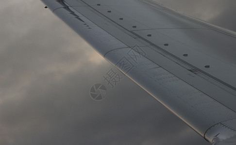 空中飞机在飞行中的天翼飞行平民飞行器柔软度飞机场飞机旅行乘客目的地假期日出图片