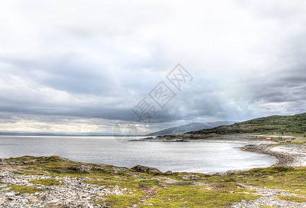 挪威北部地貌景观农村反射旅行石头风景天空支撑海岸线海洋岩石图片