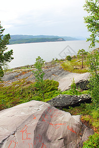 Alta的岩石雕刻岩石天空石头峡湾博物馆资源遗产松树红色雕刻品图片
