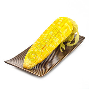 在孤立的菜盘中煮玉米蔬菜菜单素食食品黄色烹饪盘子食物背景图片