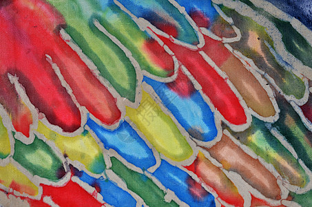 色彩多彩的抽象 Hatik 模式细节红色绿色黄色蓝色织物背景图片