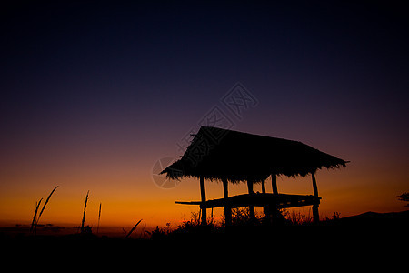 挂件日落阴影建筑小屋橙子稻草假期热带天空旅行图片