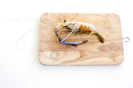 白木桌板上砍板上的虎虾甲壳老虎白色毛巾盘子桌子食物餐巾海鲜动物图片