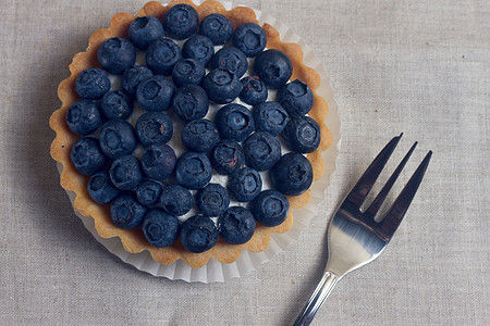 带新鲜蓝莓的塔特莱早餐面包蓝色商品美食脆皮木头奶油餐厅糖果图片