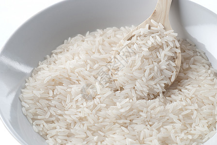 未煮熟稻米勺子麸质食物背景图片