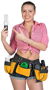 持有节能灯的工具带中的妇女女性工作乐器微笑维修工作室职业节能牛仔裤照片图片