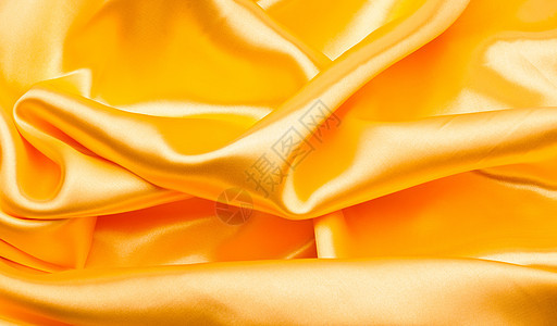 平滑优雅的金色纺织品涟漪曲线投标织物黄色材料布料折痕金子图片