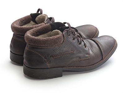 冬季靴棕色皮革靴子毛毡鞋类背景图片
