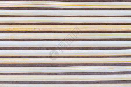 紧闭米花棕竹垫的大型蜜蜂褐色竹毯 作为条纹背景 t图片