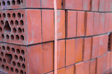 特写硅酸盐砖堆建筑学黏土石工砖厂工业制造业橙子长方形红色塑料图片