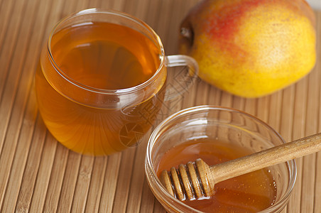 茉莉茶加蜂蜜蜂蜜棒绿茶饮食早餐暖光蜂蜜黄色热饮图片
