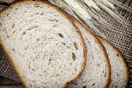 布莱德谷物面包棕色脆皮种子粮食食物早餐亚麻圆形图片