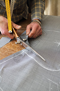 真正的裁缝纺织品风俗工作男人模型套装测量木头接缝织物图片