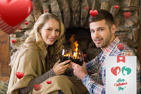 浪漫情侣在燃起的壁炉前烤葡萄酒杯的复合图像绘图衬衫庆典夫妻房间酒杯亲密感计算机玻璃饮料图片