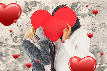 冬季情侣的复合形象 以心脏形状装扮成心形卡片夫妻帽子女性羊毛男人灰色亲密感隐藏衣物图片